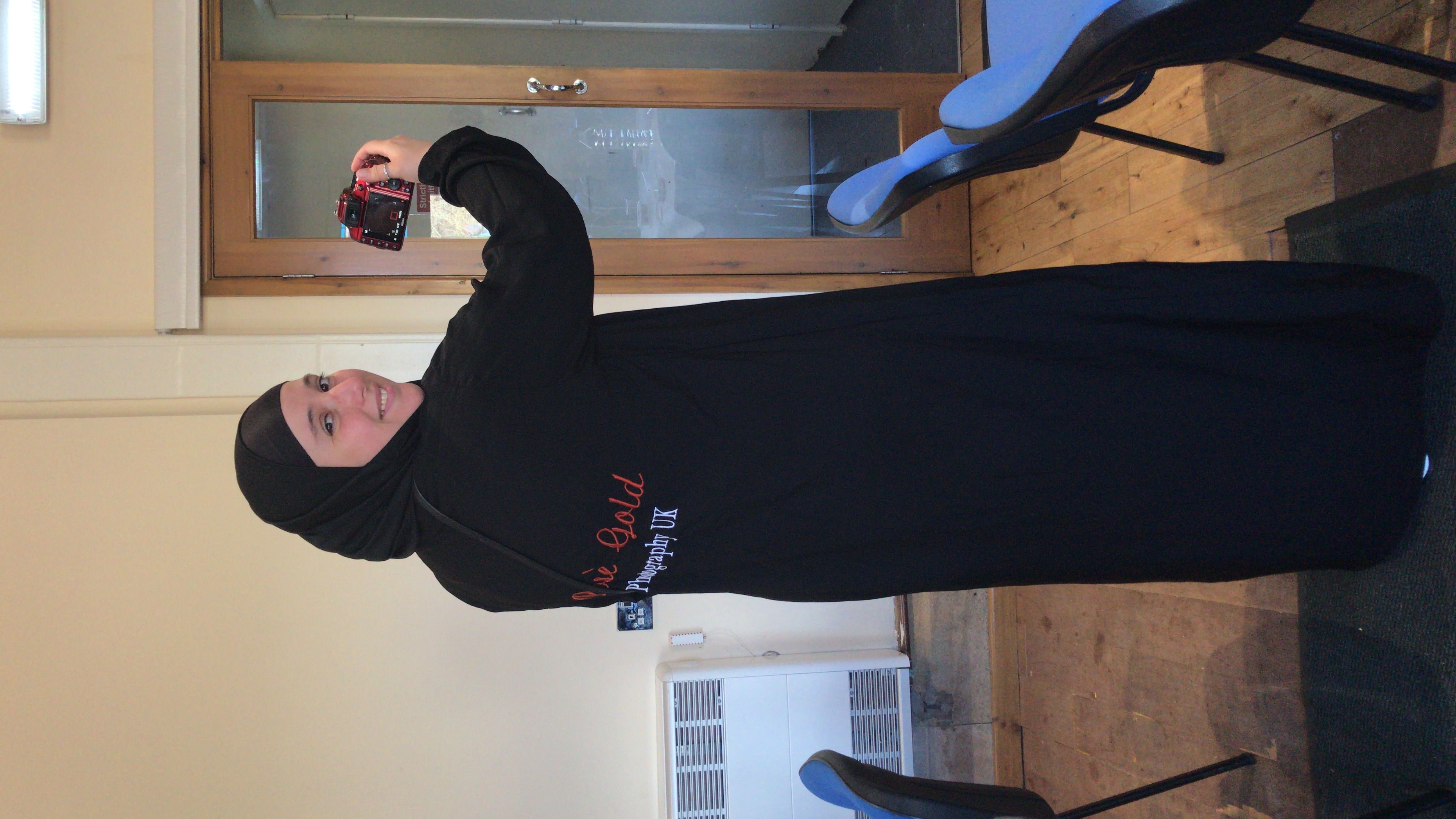 Portrait of Amal Mardiya while working, with her face clearly visible.